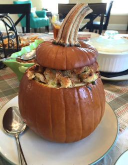 A sugar pumpkin baked with stuffing makes an attractive addition to the holiday table.