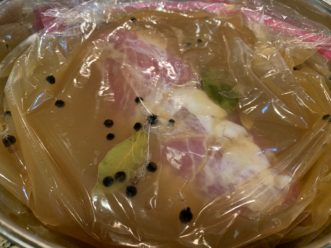 Marinating a pork tenderloin in a sealed bag in the refrigerator, Kimberly Baker, ©2020, Clemson Extension