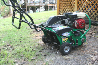 A core aerator for lawns pulls up plugs of soil. Gary Forrester, Regional Horticulture Extension Agent, Clemson Extension