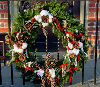 Cotton bolls and pine cones add a nice Southern touch to a Fraser fir wreath.