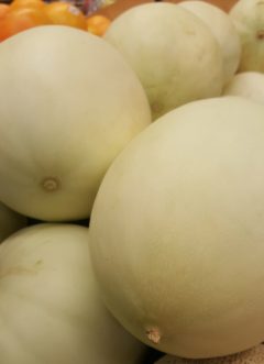 Honeydew melons are smooth skinned with green, white, orange, or pink flesh.