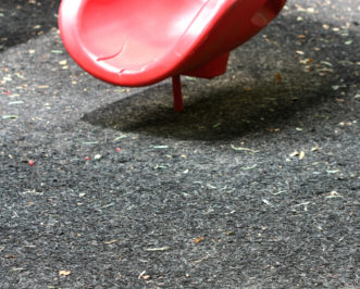 Shredded rubber mulch is often used on playgrounds, such as beneath the base of this slide.