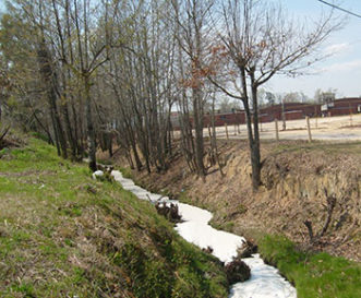 Illicit discharges may be easily identified by the public when the water from a pipe or within a ditch has an unusual color or odor, or a cloudy, soapy or oily appearance. This stream has been polluted by paint, which is an illegal discharge, affecting water quality, habitat, and aquatic life.