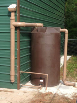 Figure 3. A 900-gallon cistern located at PACE Academy in Charleston, SC. The first flush diverter, depicted on left hand side of photo, diverts the first flush of water, which contains the most debris and potential pollutants