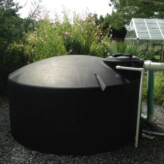 Figure 4. A 1,100-gallon cistern located at the Clemson University Coastal Research and Education Center in Charleston, SC. This system is set on a timer to deliver water to a drip irrigation system that waters adjacent landscaped beds and greenhouse
