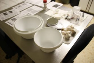 Double bowl method for weighting submerged herb or garlic in 3% citric acid solution.