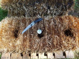 Small hand saws work well for cutting divots into a bale for planting. 