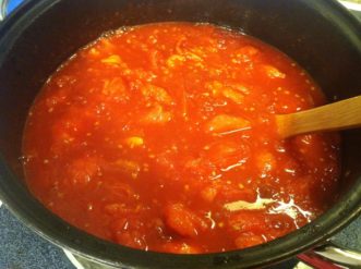 Stewed tomatoes for freezing.