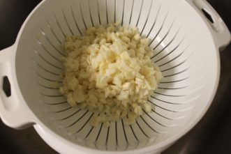Strained garlic after soaking for 24 hours in 3% citric acid solution.