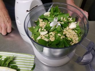 Basil, garlic, and pine nuts are initially coarse chopped in a food processor.<br />LayLa Burgess, ©2018, HGIC, Clemson University