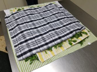 Towels can be layered if there is an abundance of basil.<br />LayLa Burgess, ©2018, HGIC, Clemson University