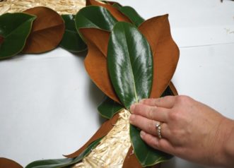 Using three leaves the same size, secure with a fern pin in the middle of the wreath form. 