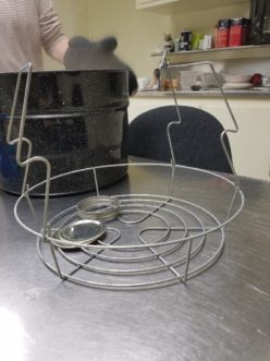 Bottom racks used in deep pots allow for easy jar, bottle, and lid sterilization.