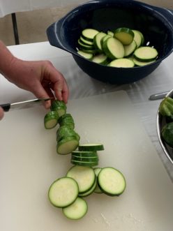 Preparing zucchini to be pickled. 
