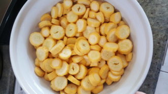 Fresh bowl of cut up yellow squash.