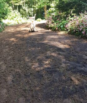 Additional organic matter is tilled into the topsoil for improved soil aeration and drainage.