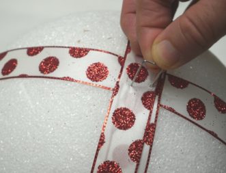 Wrap the Styrofoam ball with ribbon and pin in place with a fern pin.