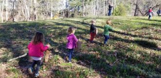 Garden Sprout class collecting sticks.