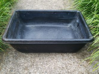 Renovate, recycle, and reuse. Turn an old plastic drywall mixing tub into a usable planter. LayLa Burgess, ©2019 HGIC, Clemson Extension