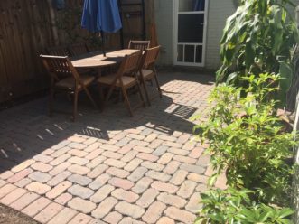  “A patio made of interlocking pavers allows water to infiltrate during a rain event.” 