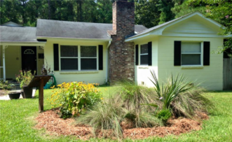 “Water falling on the roof is directed towards this rain garden using gutter, downspout, and buried corrugated pipe. The rain garden provides an opportunity for water to slow down and to infiltrate.”