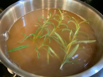 Bring 2 cups of cider and rosemary to a boil in a small saucepan over medium-high heat. Kimberly Baker, ©2020 Clemson Extension