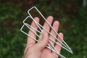 Use sod staples to secure the netting to the ground every 2-3 feet. Cory Tanner, ©2021, Clemson Extension