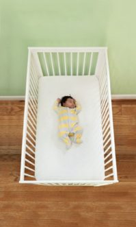 Infant in crib. Image courtesy of the Safe to Sleep® campaign, for educational purposes only; Eunice Kennedy Shriver National Institute of Child Health and Human Development, http://www.nichd.nih.gov/sids; Safe to Sleep® is a registered trademark of the U.S. Department of Health and Human Services
