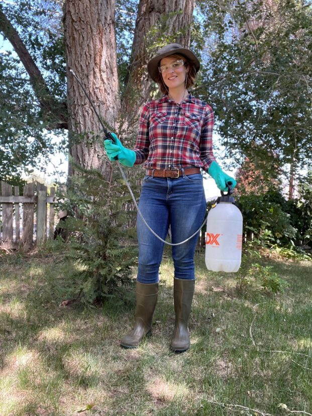 Fig. 2 Personal protective equipment (PPE) includes a long-sleeved shirt, long pants, close-toed shoes and socks, a wide-brimmed hat, and chemical-resistant gloves.