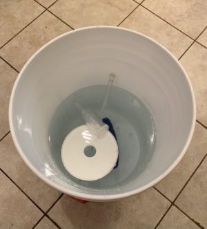 Allowing parts to soak in sanitizing bucket until ready to be used.