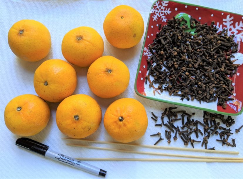 To make pomanders, you will need oranges (or other citrus), whole cloves, wooden skewers or toothpicks, and a marker.