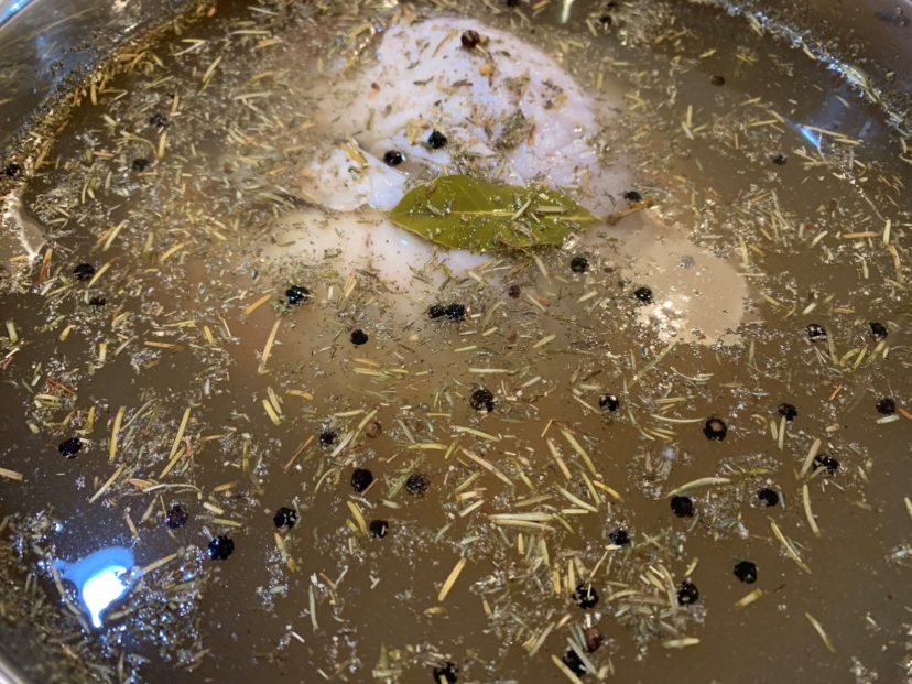 Turkey fully submerged in the wet brine.