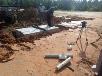Figure 1. Contractors replacing a septic system.