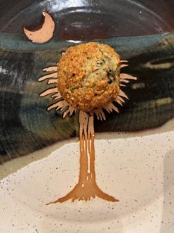 Banana Blueberry Muffin on a plate.