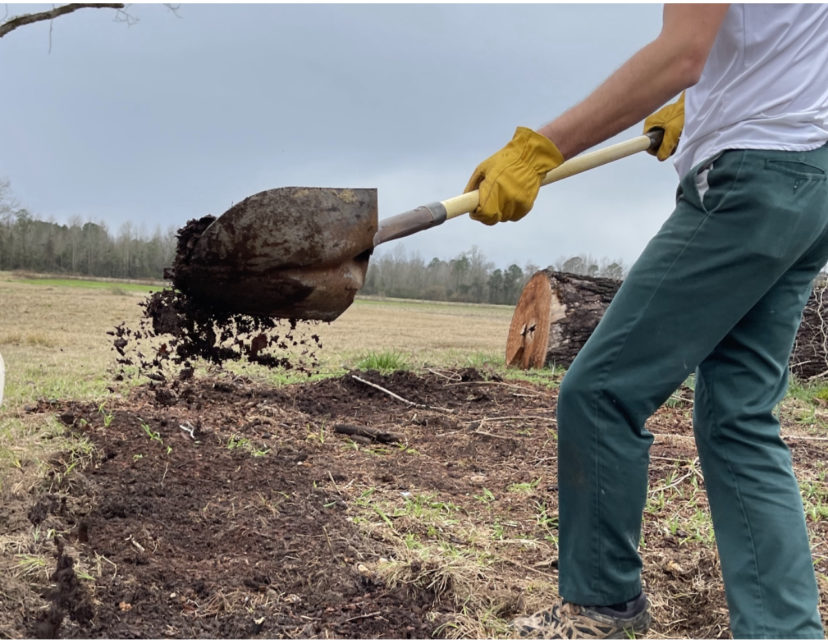 Adding compost amendments prior to planting.