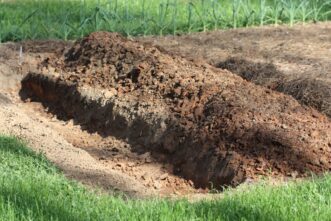 The asparagus is a perennial crop, so place the row(s) along a side of the garden space. Dig the trench 12 to 18 inches wide for the asparagus planting.