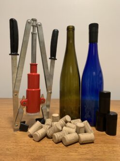 Cork, closures, double level corker, and bottles.