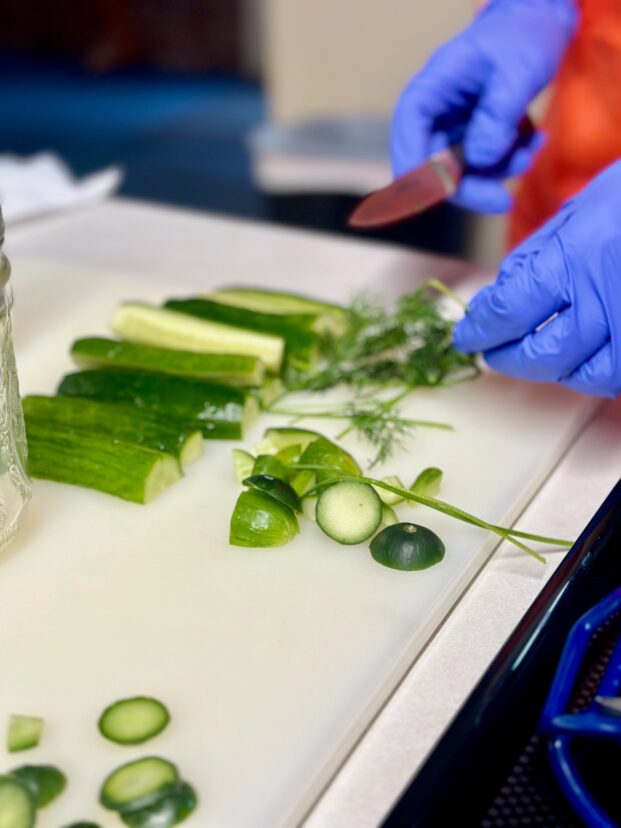 Engage everyone in the kitchen, assigning tasks from washing and chopping to mixing and tasting.
