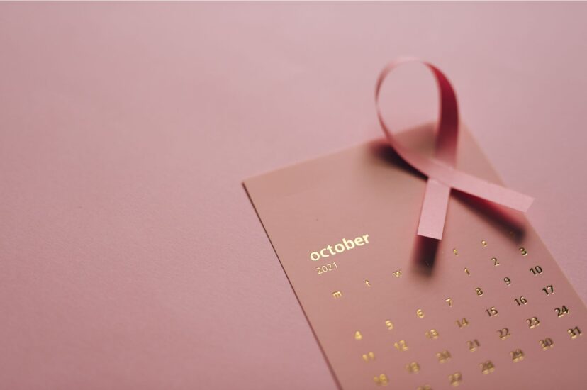 Photo of the month of October and a pink Breast Cancer Awareness ribbon. Credit: Leeloo The First for Canva.com.