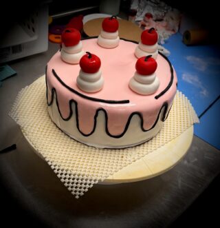 A cake with fondant frosting.