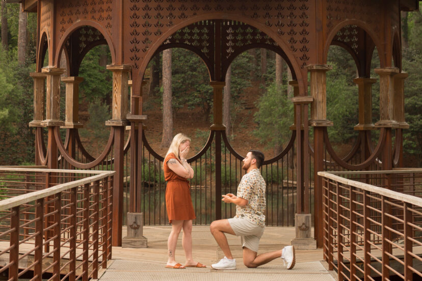 Couple celebrating their engagement at a gazebo in the South Carolina Botanical Garden.