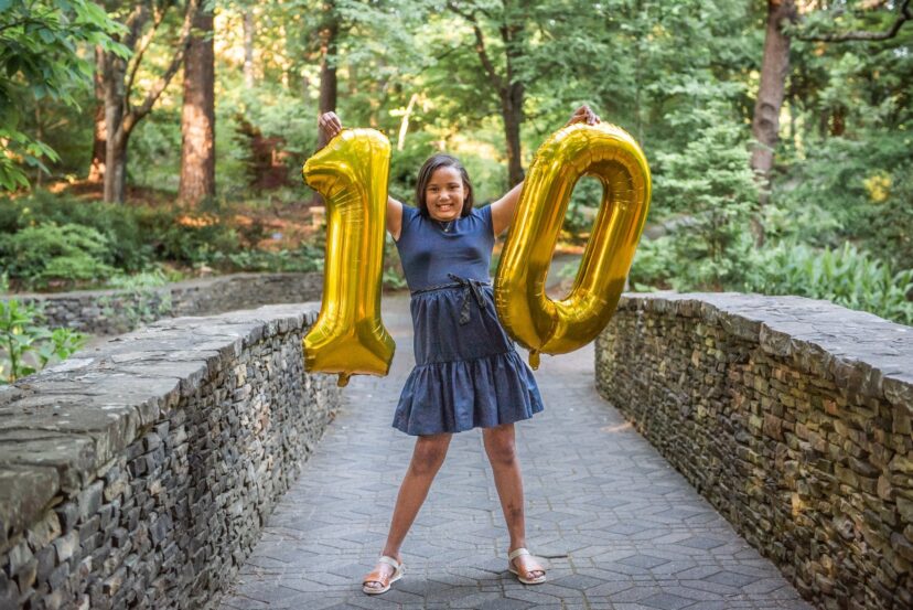 Child celebrating a birthday outdoors at the South Carolina Botanical Garden.