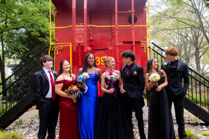 Teenagers dressed for prom posing for photos at the South Carolina Botanical Garden.