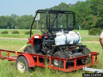 Small sprayer unit mounted on an ATV used for treating pecan tree trunks.