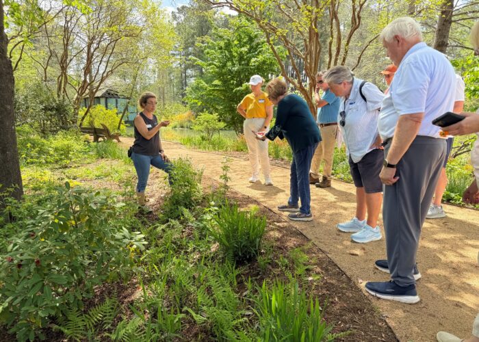 Enjoying a walking tour of garden facilities on an in-person field day.