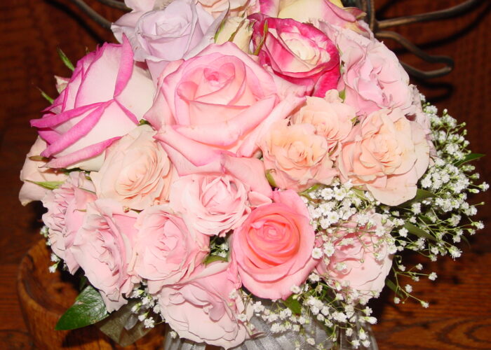 “A romantic bouquet featuring soft pink roses mixed with delicate baby’s breath, arranged to create a gentle, timeless look.”