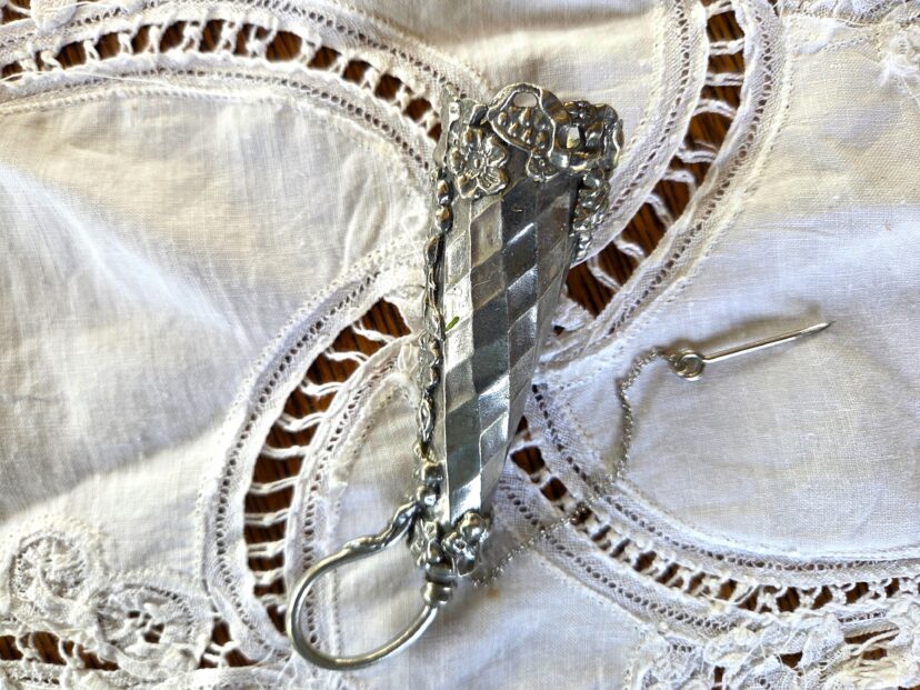 Antique tussie-mussie bouquet holder with decorative handle and chain