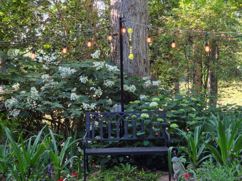 Outdoor patio lighting illuminating the Celtic garden at night