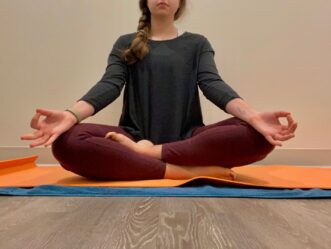 Person practicing mindfulness meditation to reduce stress and activate the body's relaxation response.