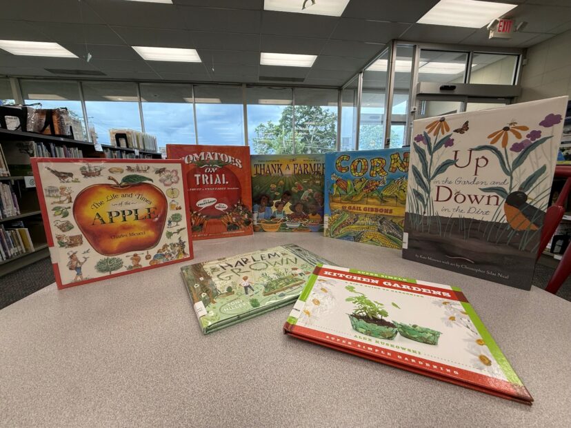Public library display featuring children's gardening books and educational resources.